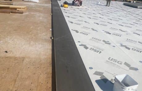 Commercial Roof Replacement, EPDM Full Tear-Off, 60 mil Carlisle Single-Ply TPO Roofing System, Skylight Fabrication and Installation, Stockton CA, Peterson Roofing, commercial roofing, flat roof replacement, EPDM roof removal, commercial skylight replacement, dry rot roof repair, insulation and cover board installation