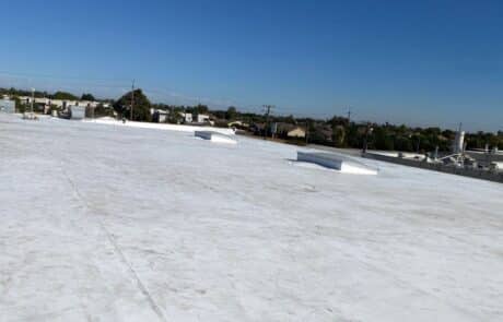 Commercial Roof Replacement, EPDM Full Tear-Off, 60 mil Carlisle Single-Ply TPO Roofing System, Skylight Fabrication and Installation, Stockton CA, Peterson Roofing, commercial roofing, flat roof replacement, EPDM roof removal, commercial skylight replacement, dry rot roof repair, insulation and cover board installation