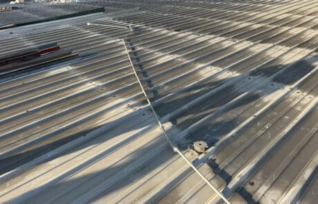 Commercial Roof Replacement, TPO Retrofit Roofing System, Modesto CA, Peterson Roofing, commercial roofing contractor, metal roof retrofit, TPO roofing membrane, flute fill insulation system, flat roof replacement, industrial roofing, roof overlay system, leak repair solution, Modesto commercial roofer