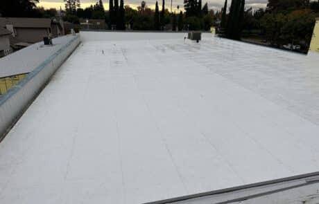 Commercial Roof Replacement, TPO Retrofit Roofing System, Modesto CA, Peterson Roofing, commercial roofing contractor, metal roof retrofit, TPO roofing membrane, flute fill insulation system, flat roof replacement, industrial roofing, roof overlay system, leak repair solution, Modesto commercial roofer