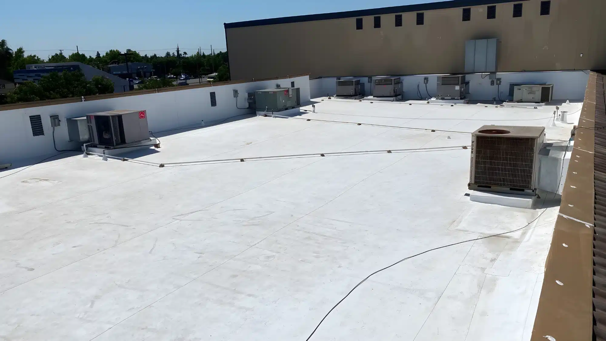 commercial building with TPO roofing membrane installation showing durable and energy efficient flat roof system for modern construction