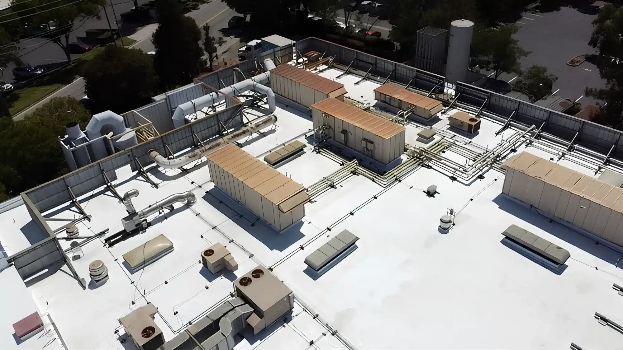 A reliable commercial roofing company near you inspecting a roof before rainy weather.
